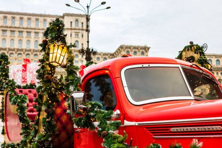 Bucharest Christmas market in front of the Palace of Parliament, traditional historic Christmas van in Bucharest city, Romania, 2019のeditorial素材
