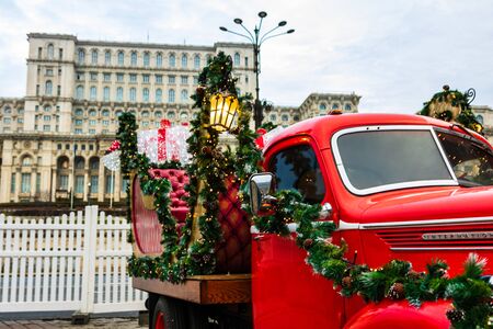 Bucharest Christmas market in front of the Palace of Parliament, traditional historic Christmas van in Bucharest city, Romania, 2019のeditorial素材