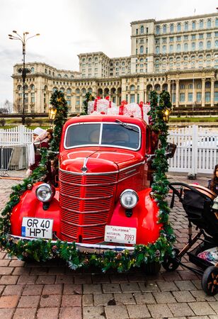 Bucharest Christmas market in front of the Palace of Parliament, traditional historic Christmas van in Bucharest city, Romania, 2019のeditorial素材