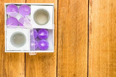 Detail view of candles on wooden background, top view, copy space for text, close up photoの写真素材