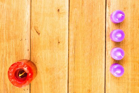 Detail view of candles on wooden background, top view, copy space for text, close up photoの写真素材