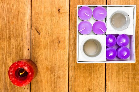Detail view of candles on wooden background, top view, copy space for text, close up photoの写真素材