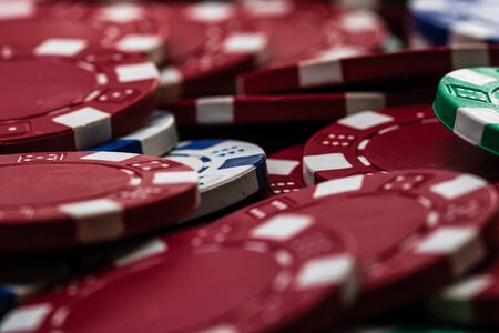 Poker chips close up background. Casino concept, risk, chance, good luck or gambling. Detail of casino chipsの写真素材