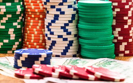 Poker casino chips and money close up. Casino concept, risk, chance, good luck or gambling. Detail of casino chips, EURO, US dollarsの写真素材