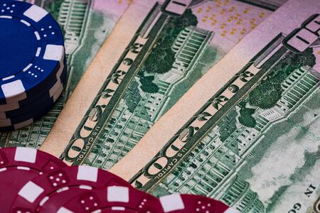 Poker casino chips and money close up. Casino concept, risk, chance, good luck or gambling. Detail of casino chips, EURO, US dollarsの写真素材