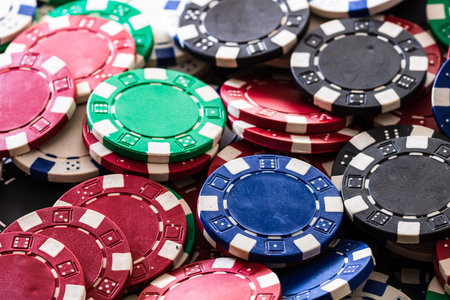 Poker chips close up background. Casino concept, risk, chance, good luck or gambling. Detail of...