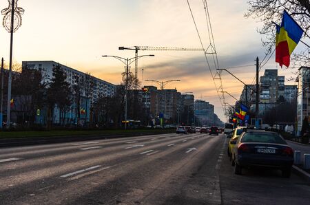 Car traffic at sunset on the streets of Bucharest, Romania, 2020のeditorial素材
