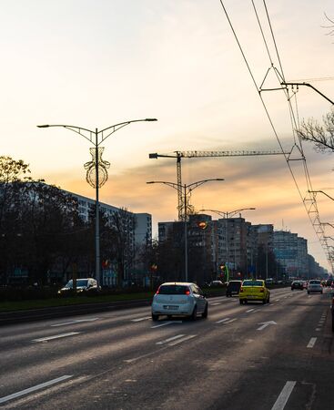Car traffic at sunset on the streets of Bucharest, Romania, 2020のeditorial素材