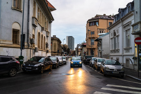 Traffic on the narrow streets in downtown Bucharest. Winter morning in Bucharest, Romania, 2020のeditorial素材
