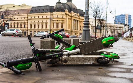 Abandoned Lime-S electric scooter of the company Lime in the street in Bucharest, Romania, 2020のeditorial素材