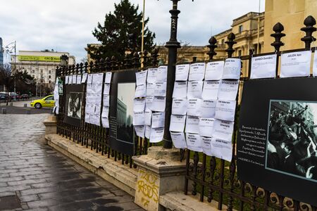 Names of the heroes murdered at the 1989 Romanian Revolution on the fence of National Art Museum in Bucharest, Romania, 2020のeditorial素材