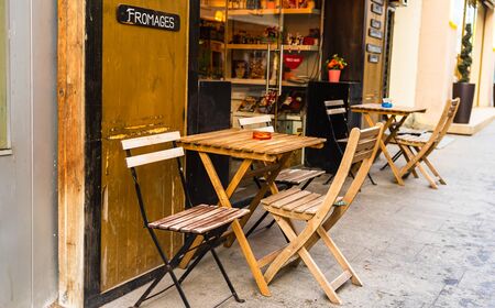 Empty tables at a coffee shop on Victoriei Way (Calea Victoriei) in old town Bucharest, Romania, 2020のeditorial素材