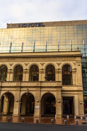 Reflections of early morning sky in the windows of Novotel Hotel in old town of Bucharest, Romania, 2020のeditorial素材
