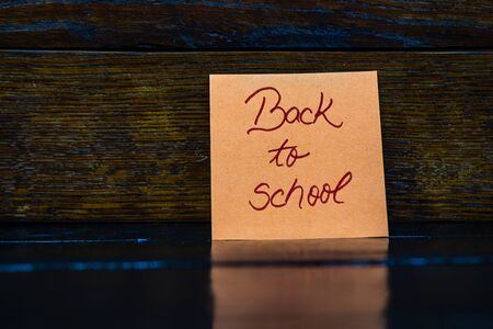 Memo post reminder with text Back to school.の写真素材