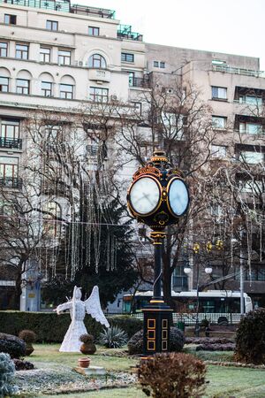 Winter scene, empty alley in Cismigiu Gardens Park, Bucharest vintage clock covered in ice in Bucharest, Romania, 2020のeditorial素材
