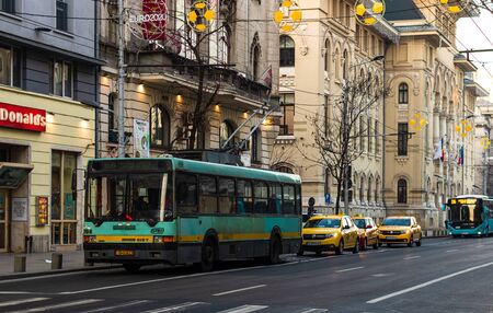 Car traffic on the main boulevard in Bucharest downtown. Winter morning/evening rush hour in Bucharest, Romania, 2020のeditorial素材