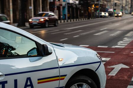Romanian police car in traffic during rush hour in Bucharest, Romania, 2020のeditorial素材