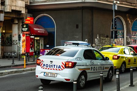 Romanian police car in traffic during rush hour in Bucharest, Romania, 2020のeditorial素材
