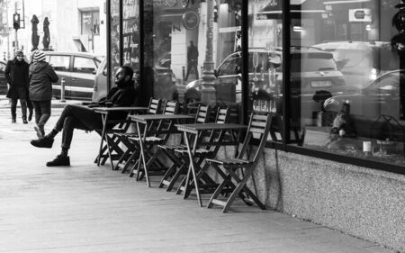 Lonely man enjoying his coffee in a winter morning in Bucharest, Romania, 2020のeditorial素材