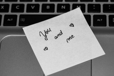 Writing love text on memo post reminder. Sticker with lovely message. Text on notepaper.の写真素材