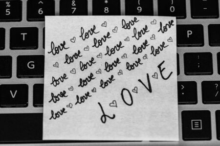 Writing love text on memo post reminder. Sticker with lovely message. Text on notepaper.の写真素材