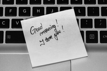 Writing love text on memo post reminder. Sticker with lovely message. Text on notepaper.の写真素材