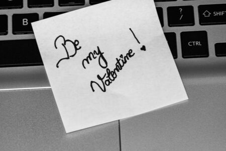 Writing love text on memo post reminder. Sticker with lovely message. Text on notepaper.の写真素材