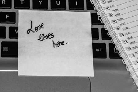 Writing love text on memo post reminder. Sticker with lovely message. Text on notepaper.の写真素材
