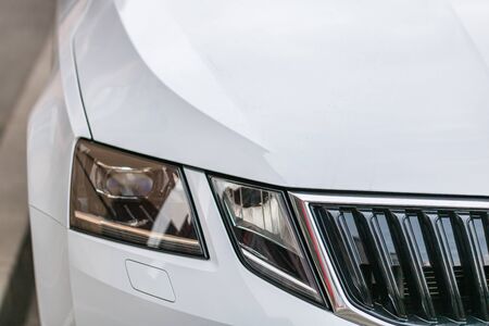 Close up photo of modern and clean car, detail of headlight. Headlight car Projector/LED of a modern luxury technology and auto detail.の写真素材