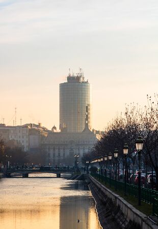 View of the Old Town of Bucharest from a bridge over Dambovita river, in the morning foggy light, Bucharest, Romania, 2020のeditorial素材