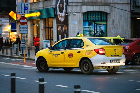 Car taxi waiting for a client in the middle of the street in Bucharest, Romania, 2020のeditorial素材