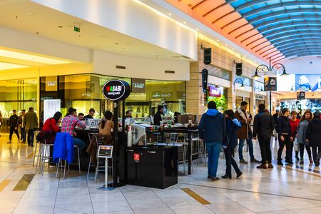 Shoppers visit the mall during winter at discount and sale season. AFI Cotroceni Shopping Mall in Bucharest, Romania, 2020のeditorial素材