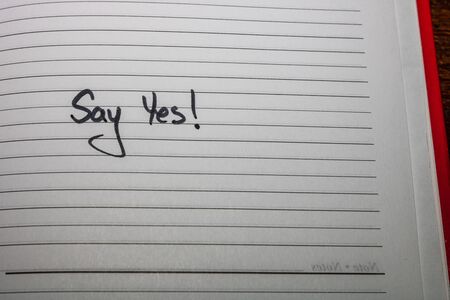 Say yes, handwriting text on page of office agenda. Copy space.の写真素材