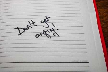 Do not get angry, handwriting text on page of office agenda. Copy space.の写真素材