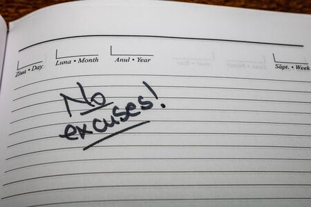 No excuses, handwriting text on page of office agenda. Copy space.の写真素材