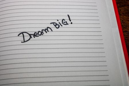 Dream big, handwriting text on page of office agenda. Copy space.の写真素材