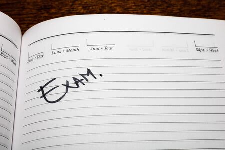 Exam, handwriting text on page of office agenda. Copy space.の写真素材