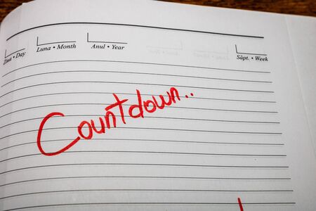 Countdown, handwriting text on page of office agenda. Copy space.の写真素材