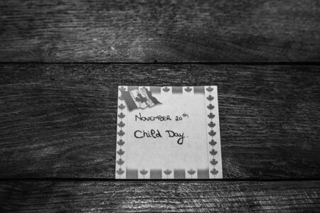 November 20th, Child day handwriting text on memo post reminder with Canada flag.のeditorial素材