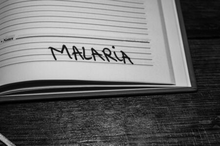 Malaria, handwriting text on page of office agenda. Copy space.のeditorial素材