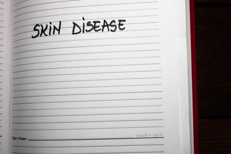 Skin disease, handwriting text on page of office agenda. Copy space.のeditorial素材