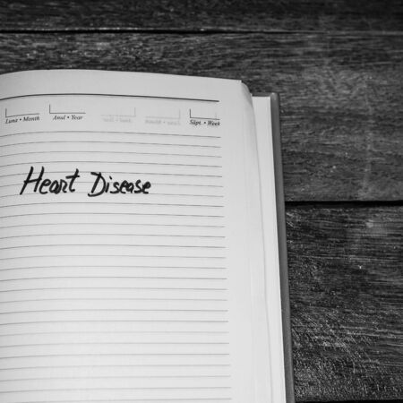 Heart disease, handwriting text on page of office agenda. Copy space.のeditorial素材