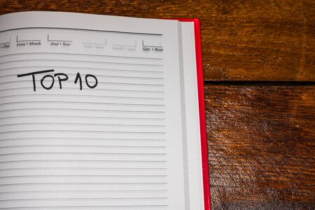 Top 10, handwriting text on page of office agenda. Copy space.のeditorial素材