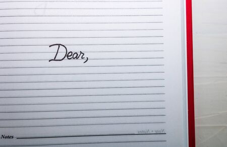 Dear, handwriting text on page of office agenda. Copy space.の写真素材
