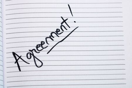 Agreement, handwriting text on page of office agenda. Copy space.の写真素材