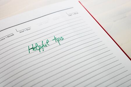 Helpful tips, handwriting text on page of office agenda. Copy space.の写真素材