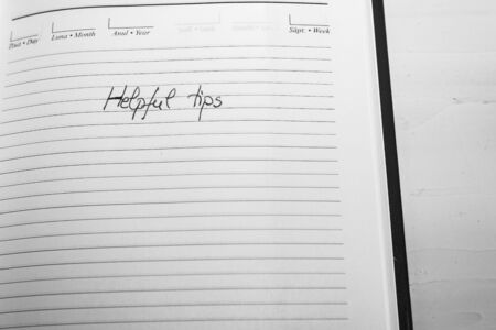 Helpful tips, handwriting text on page of office agenda. Copy space.の写真素材