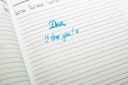 Dear, I love you, handwriting text on page of office agenda. Copy space.の写真素材