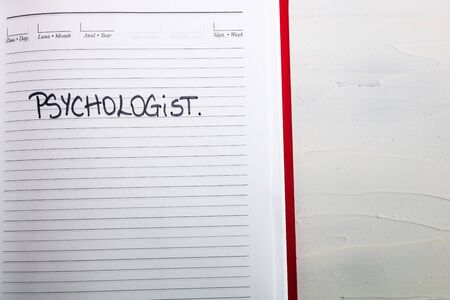 Psychologist, handwriting text on page of office agenda. Copy space.の写真素材