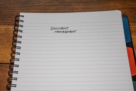 Document management, handwriting text on page of office agenda, office spiral notebook. Copy space.の写真素材